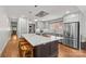 Fully equipped kitchen features stainless steel appliances, center island with seating, and ample counter space at 2112 Shenandoah Ave, Charlotte, NC 28205