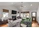 Spacious living room featuring fireplace, built-in shelving, and ample natural light at 2112 Shenandoah Ave, Charlotte, NC 28205