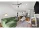 Open-concept living room with vaulted ceiling, fireplace, and access to kitchen at 2112 Shenandoah Ave, Charlotte, NC 28205