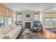 Bright living room featuring a fireplace, built-in bookshelves, and hardwood floors, exuding warmth at 2112 Shenandoah Ave, Charlotte, NC 28205