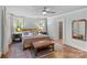 Bedroom featuring hardwood floors, a ceiling fan, and soft natural light at 2112 Shenandoah Ave, Charlotte, NC 28205
