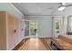 Light-filled bedroom with wardrobe, hardwood floors, and porch access at 2112 Shenandoah Ave, Charlotte, NC 28205