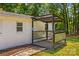 Cozy outdoor patio area showcasing a covered structure with metal accents and ample space for relaxation and entertainment at 2229 Old Wilkesboro Rd, Statesville, NC 28625