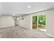 Finished basement with neutral carpet, recessed lighting, walkout to patio, and potential for flexible living space at 2229 Old Wilkesboro Rd, Statesville, NC 28625