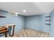 Finished basement area featuring neutral carpet and built-in shelves at 2229 Old Wilkesboro Rd, Statesville, NC 28625