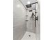 Luxurious walk-in shower with modern fixtures and gray tile at 2229 Old Wilkesboro Rd, Statesville, NC 28625