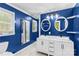 Stylish blue bathroom with double vessel sinks and modern fixtures at 2229 Old Wilkesboro Rd, Statesville, NC 28625