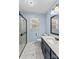 Bathroom features a glass enclosed shower, large mirror and marble floors at 2229 Old Wilkesboro Rd, Statesville, NC 28625