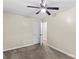 Carpeted bedroom features a ceiling fan and white painted walls at 2229 Old Wilkesboro Rd, Statesville, NC 28625