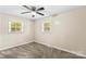 Well-lit bedroom with neutral walls and carpet flooring at 2229 Old Wilkesboro Rd, Statesville, NC 28625