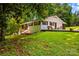 Charming home with white brick, shutters, and a manicured front yard, perfect for relaxing or entertaining at 2229 Old Wilkesboro Rd, Statesville, NC 28625