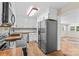 Open kitchen with stainless steel appliances that flows to the adjacent living room at 2229 Old Wilkesboro Rd, Statesville, NC 28625