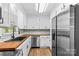 Well-lit kitchen with stainless steel appliances and beautiful wood countertops at 2229 Old Wilkesboro Rd, Statesville, NC 28625