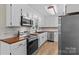 Modern kitchen with stainless steel appliances, stylish backsplash, and wood countertops at 2229 Old Wilkesboro Rd, Statesville, NC 28625