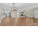 Open-concept living space featuring a fireplace, hardwood floors, and connection to the kitchen at 2229 Old Wilkesboro Rd, Statesville, NC 28625
