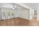 Bright and airy living room with hardwood floors, a ceiling fan, and multiple windows at 2229 Old Wilkesboro Rd, Statesville, NC 28625
