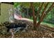 Exterior shot showcasing a charming pond with rock features set against the backdrop of a lush, wooded landscape at 2229 Old Wilkesboro Rd, Statesville, NC 28625
