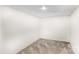 Empty carpeted room with white walls and ceiling spotlight at 2229 Old Wilkesboro Rd, Statesville, NC 28625