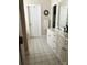 Bright bathroom featuring double vanity, white cabinets, and tiled flooring at 2300 Wednesbury Ct, Kannapolis, NC 28083