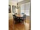 Cozy dining area featuring a wood table, four chairs, and natural light from the window at 2300 Wednesbury Ct, Kannapolis, NC 28083