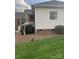 Exterior view of a house featuring brick accents and manicured landscaping at 2300 Wednesbury Ct, Kannapolis, NC 28083