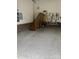 Spacious garage with epoxy flooring, half brick walls, pegboard storage, and staircase at 2300 Wednesbury Ct, Kannapolis, NC 28083