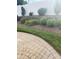 Professionally landscaped yard with tiered flowerbeds, lush greenery, and manicured lawn for enhanced curb appeal at 2300 Wednesbury Ct, Kannapolis, NC 28083