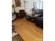 Living room featuring hardwood floors, two chairs, and a leather couch at 2300 Wednesbury Ct, Kannapolis, NC 28083
