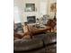 This living room features a fireplace, mantle with TV, and hardwood floors at 2300 Wednesbury Ct, Kannapolis, NC 28083