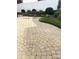 Beautiful backyard patio with decorative brickwork, attractive landscaping, and ample space for outdoor entertaining at 2300 Wednesbury Ct, Kannapolis, NC 28083