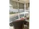 Relaxing screened-in porch with wicker furniture, offering an inviting space to unwind and enjoy the outdoors at 2300 Wednesbury Ct, Kannapolis, NC 28083
