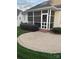 View of a cozy screened porch accessible from a brick patio at 2300 Wednesbury Ct, Kannapolis, NC 28083