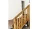 Interior staircase with wooden banister and accents leading to an upper level within the home at 2300 Wednesbury Ct, Kannapolis, NC 28083