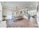 Elegant dining room with a long wood table, stylish decor, and easy access to the staircase at 2816 Woodlands Creek Dr, Monroe, NC 28110