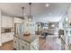 Spacious kitchen island connects to a open living space with modern appliances and ample storage for the discerning home chef at 2816 Woodlands Creek Dr, Monroe, NC 28110