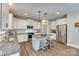 Modern kitchen boasts stainless steel appliances, granite countertops, and a stylish kitchen island with pendant lighting at 2816 Woodlands Creek Dr, Monroe, NC 28110