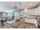 Open-concept kitchen with granite island and easy access to the adjacent dining and living area, great for entertaining at 2816 Woodlands Creek Dr, Monroe, NC 28110