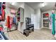 Walk-in closet with cosmetic table, drawers, custom shelving, hanging racks, and luxury vinyl flooring at 2816 Woodlands Creek Dr, Monroe, NC 28110