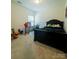 Bedroom with neutral walls and carpet, a window, and a desk setup at 2921 Parkwest Dr, Albemarle, NC 28001