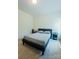 Modern bedroom with a gray bed, sleek design, and bright natural light for a cozy and inviting space at 2921 Parkwest Dr, Albemarle, NC 28001