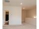 Large bonus room features neutral walls and carpet, recessed lighting, and a bathroom entrance at 2921 Parkwest Dr, Albemarle, NC 28001