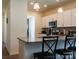Kitchen featuring granite countertops, stainless steel appliances, and bar stool seating at 2921 Parkwest Dr, Albemarle, NC 28001