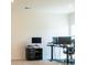 Well-lit office space with a modern desk setup and carpeted floors at 2921 Parkwest Dr, Albemarle, NC 28001