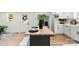 Open kitchen with a center island and modern appliances, seamlessly connected to other spaces at 300 Cherry St, Belmont, NC 28012