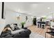 Open-concept living room with modern sofa, stylish decor, and access to kitchen at 300 Cherry St, Belmont, NC 28012