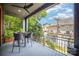 Enjoy outdoor living on this spacious balcony with a ceiling fan, table, and scenic views at 3026 Kalex Ct, Charlotte, NC 28204