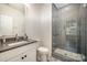 Bathroom featuring a glass shower and tiled floors at 3026 Kalex Ct, Charlotte, NC 28204
