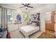 Comfortable bedroom with natural light, ceiling fan, and closet access at 3026 Kalex Ct, Charlotte, NC 28204