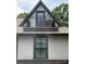 Charming home detail featuring a small balcony with a dark metal railing on the upper level at 3026 Kalex Ct, Charlotte, NC 28204