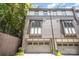 Townhome featuring gray brick and a gray garage door at 3026 Kalex Ct, Charlotte, NC 28204